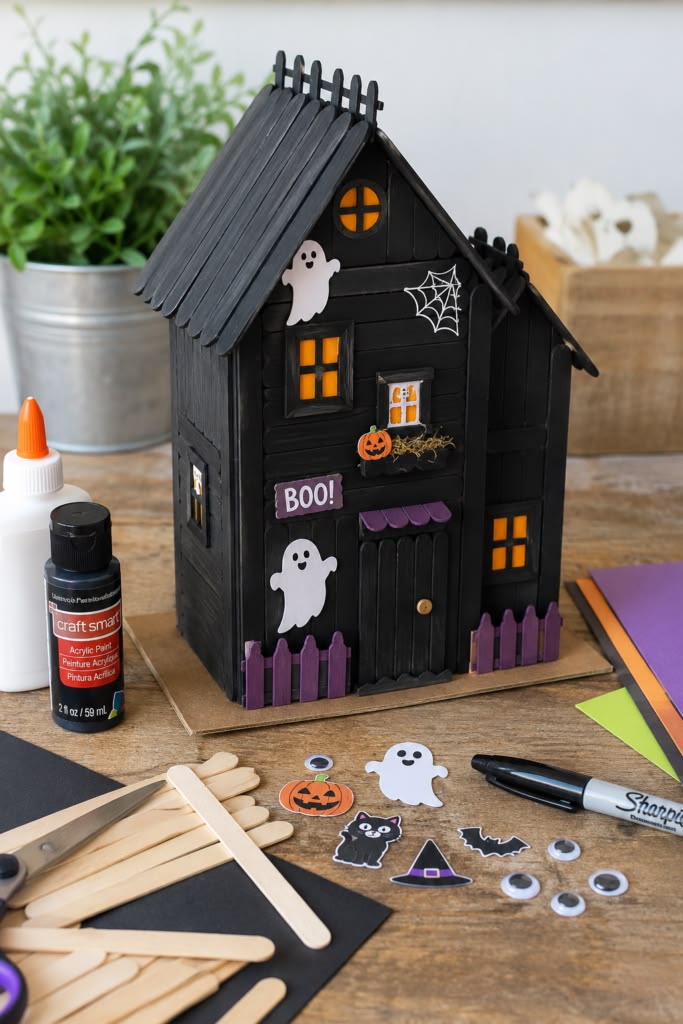 kids making cereal box haunted house