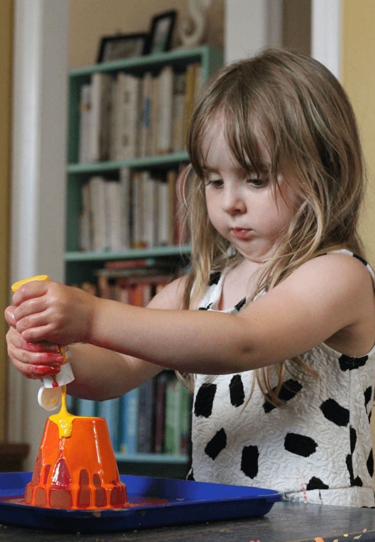 kid making halloween wind chime