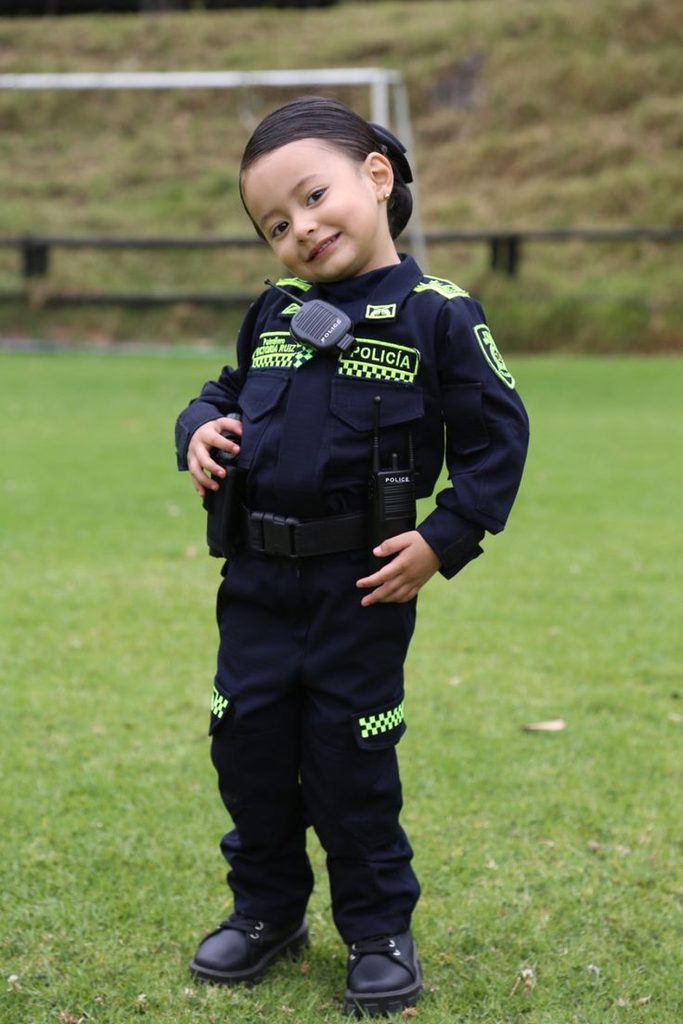 kid in police officer costume 