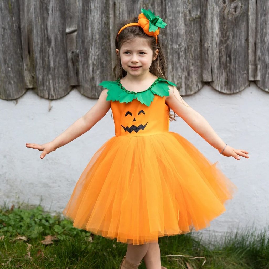 kid in pumpkin costume