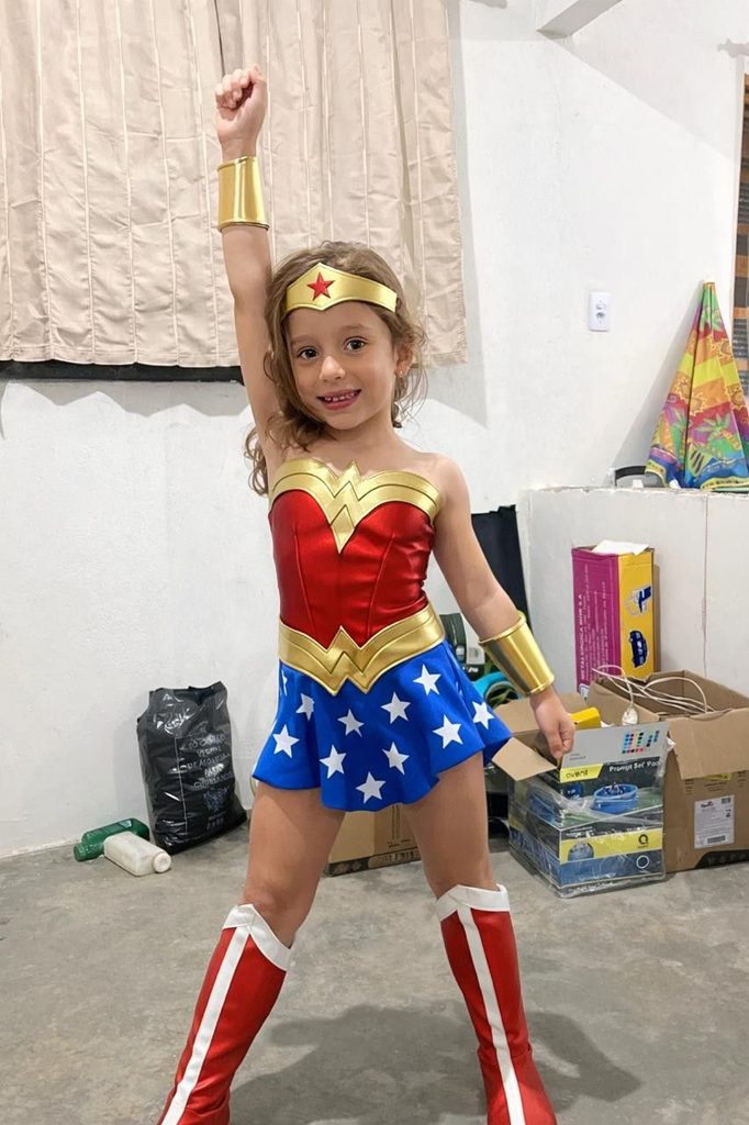 kid with superhero costume as one of the halloween costume ideas for kids