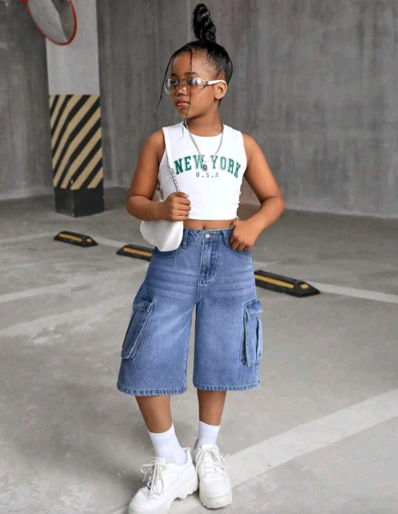 kid in short denim and tank