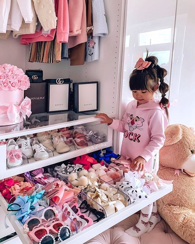 kid in her closet with outfit formula