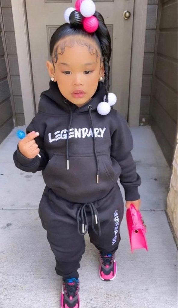 kid in joggers and sweatshirt