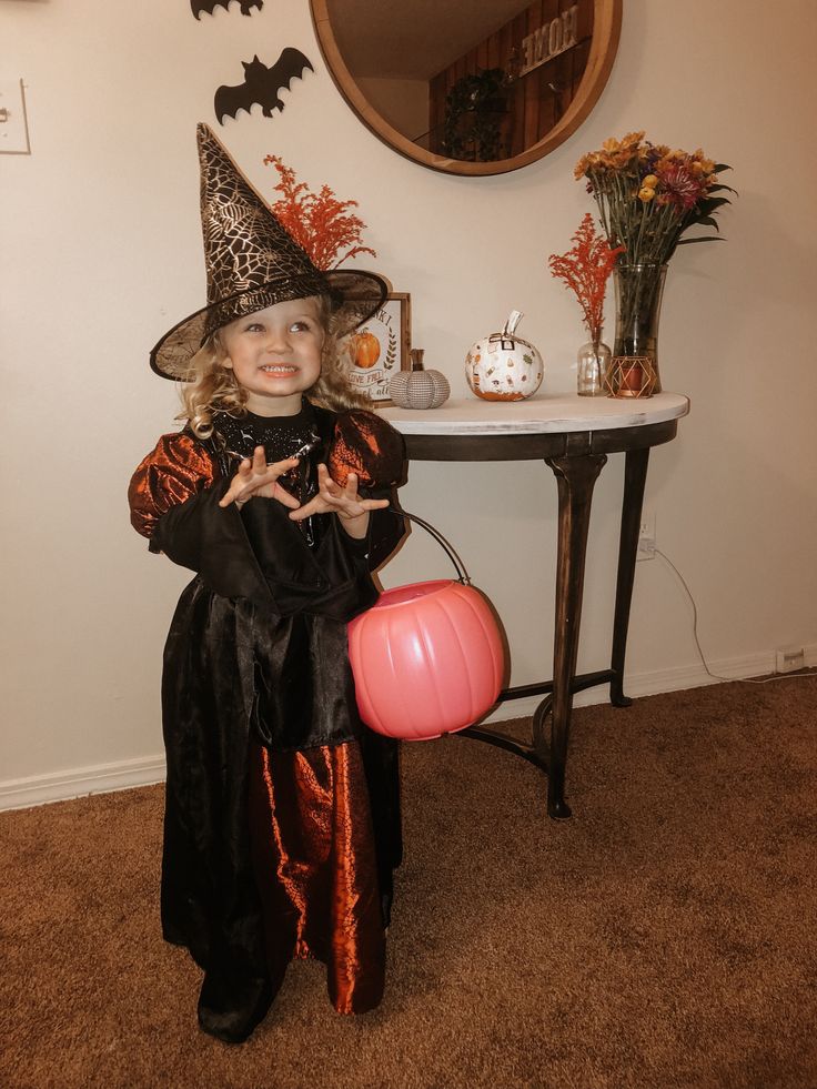 kid in witch costume