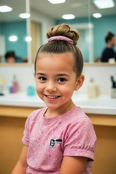 kid with high bun as protective hairstyles for kids