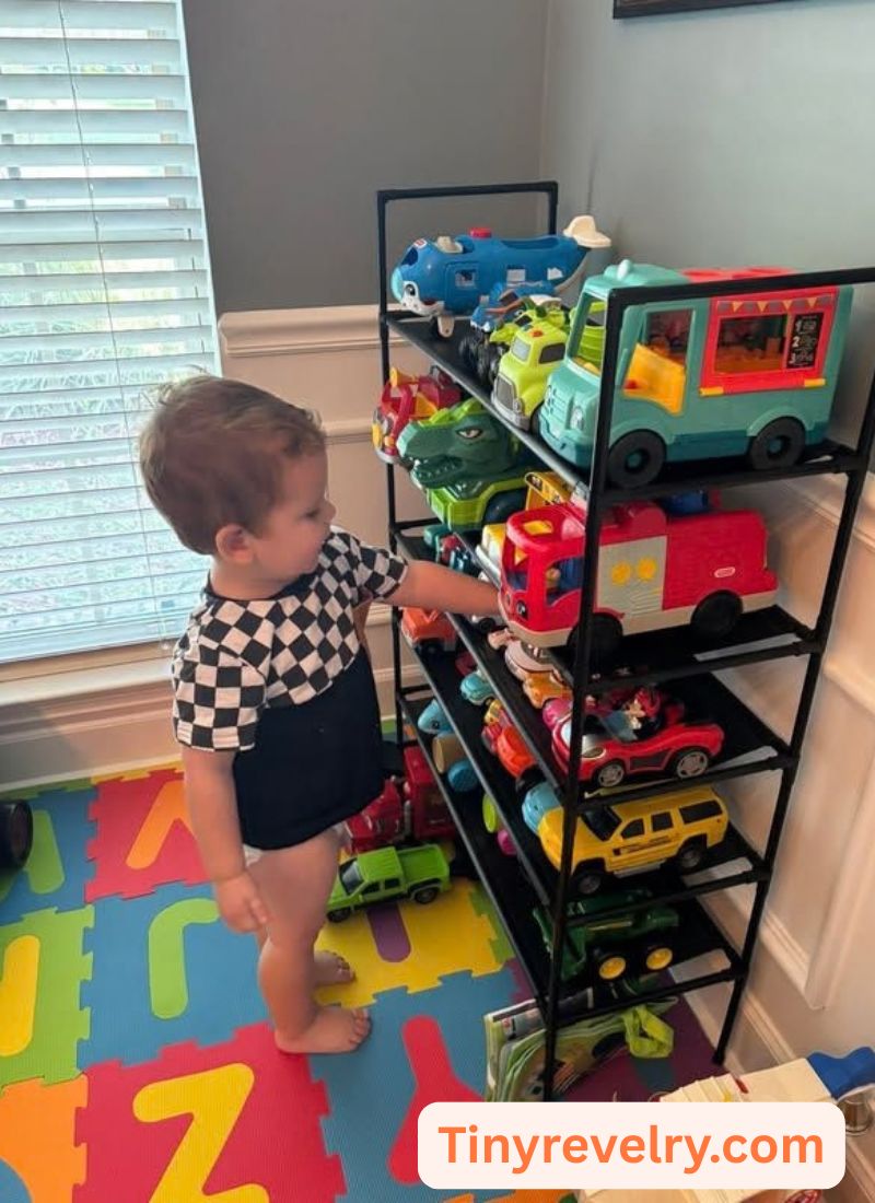 kid getting his toys from the rack