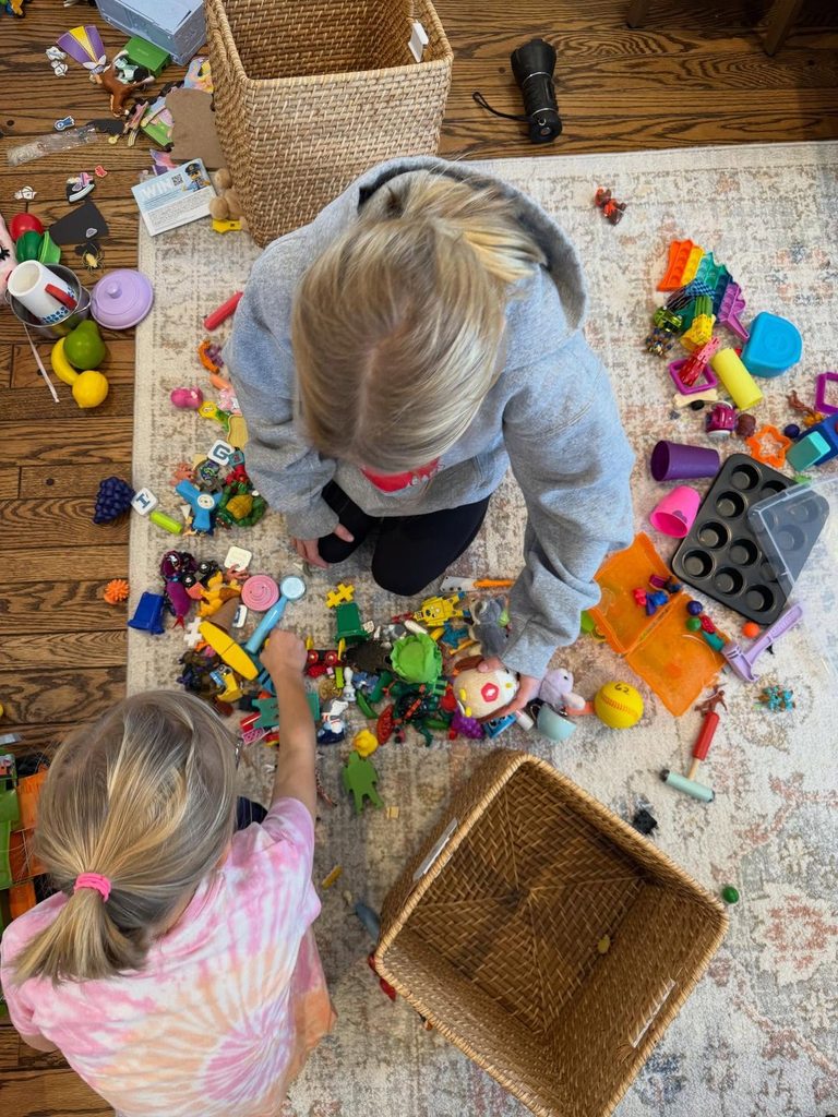 kids arranging her toys