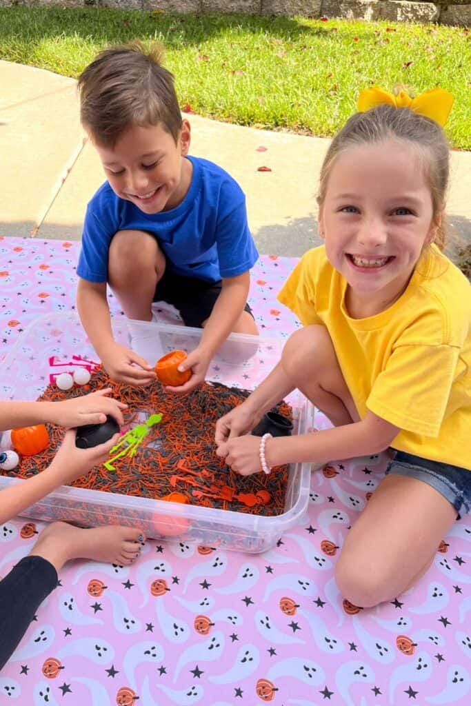 kids in sensory bin