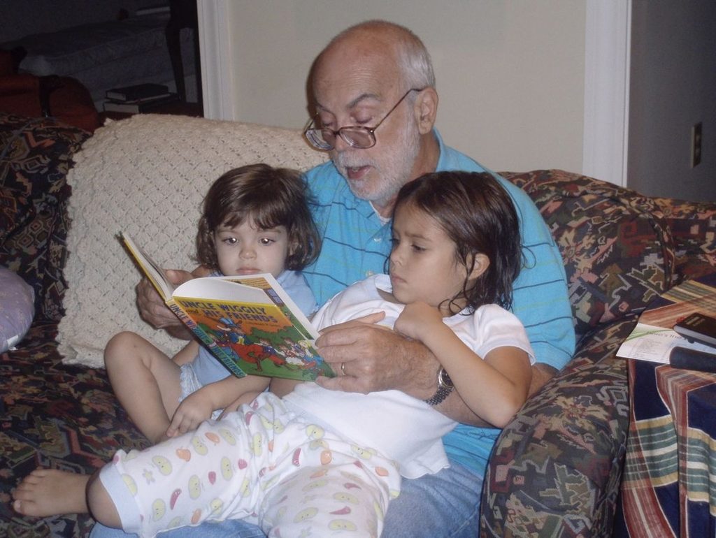 grand father telling kids halloween tradition story as halloween learning activities for kids