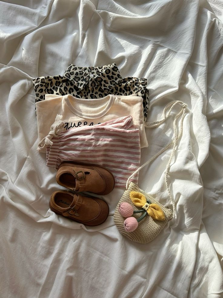 kids wears laid on the bed