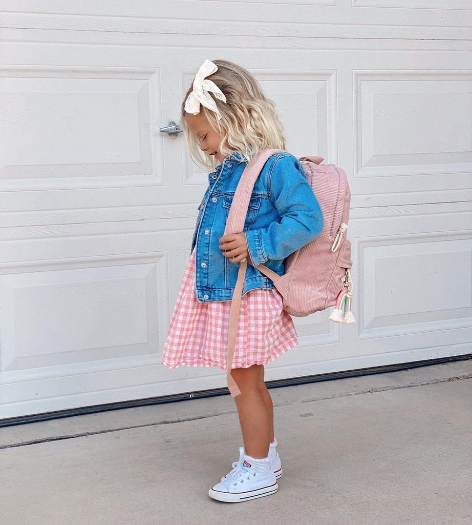 school kid in gown and gown and denimjacket as easy school morning dressing