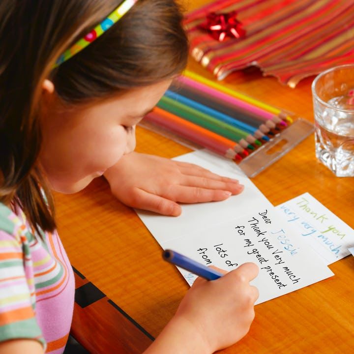 kid writing thank you note