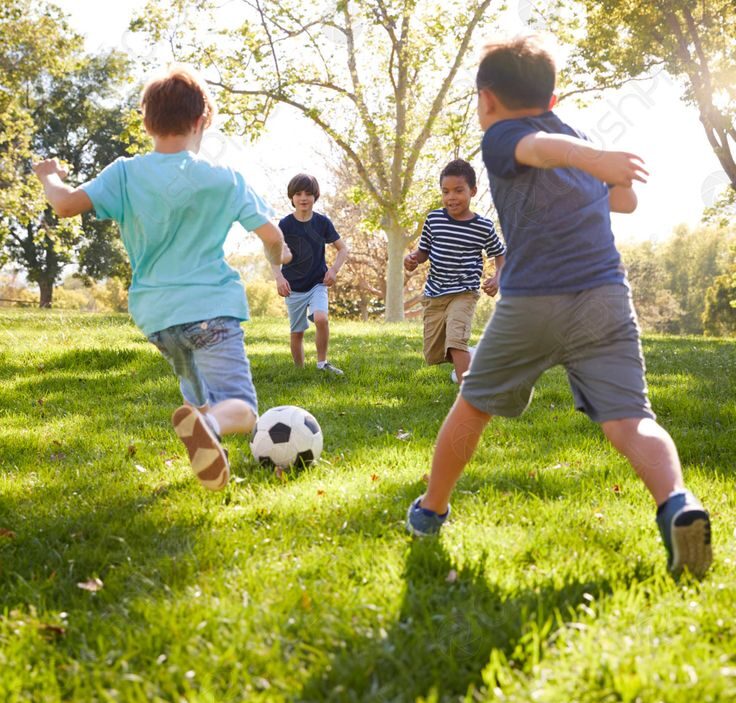 kids playing football outdoor as Thanksgiving activities for kids